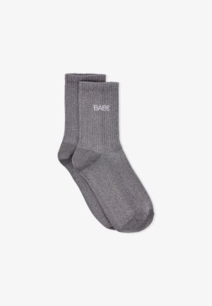 Gray cotton crew socks, featuring ribbed texture and a subtle white logo. Designed with a standard sock shape and finished edges.