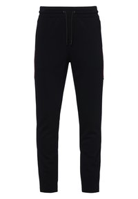 Svarta sweatpants med elastiskt midjeband och dragsko. Har röda sidodetaljer och avsmalnande ben. Mjukt tyg med fickor.