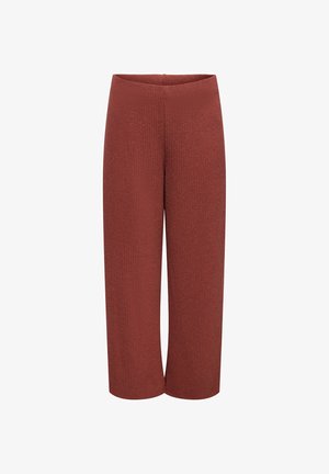 Swetry w kolorze rdzy o szerokich nogawkach z wysokim stanem i lekko fakturowaną tkaniną, prezentowane na białym tle.