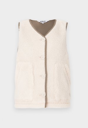 Gilet en polaire couleur crème avec un col en V, quatre boutons et deux poches avant. Accentué d'une doublure marron contrastante. Surface douce et texturée.