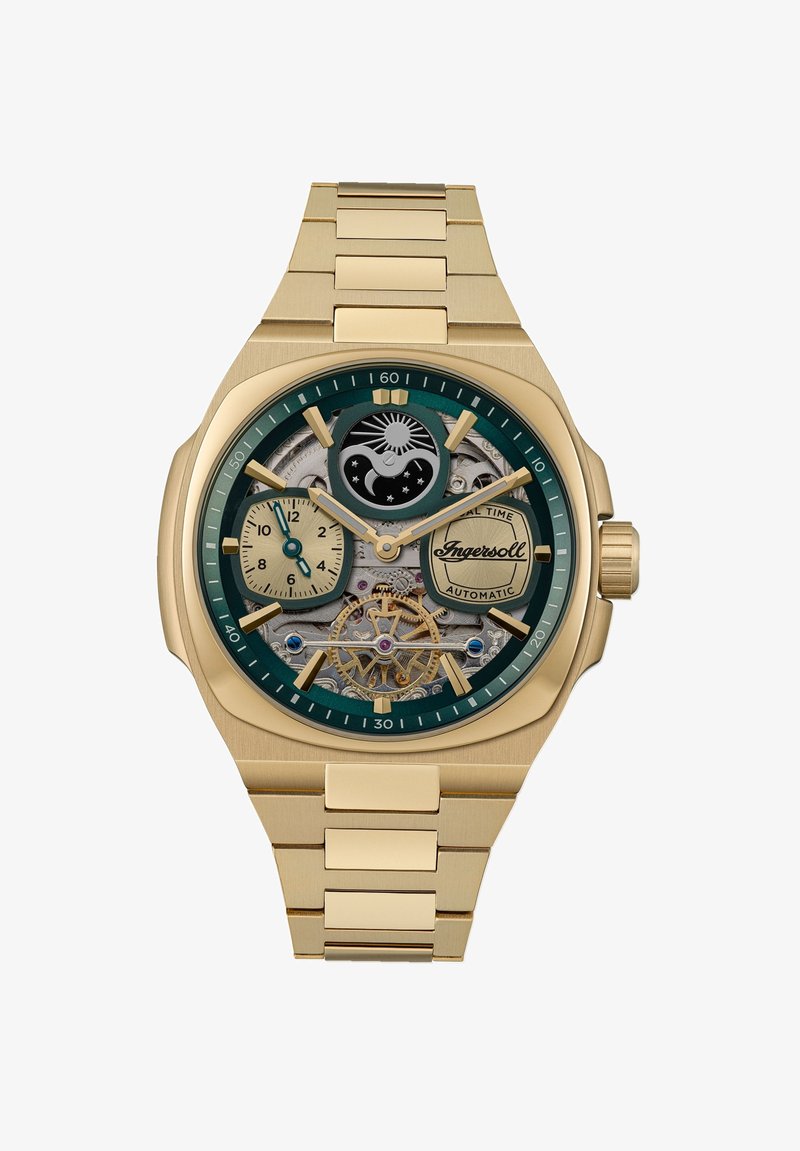 Gouden automatische horloge met een groene wijzerplaat, skeletontwerp dat ingewikkelde mechanica onthult, en twee sub-dials voor extra tijdwaarneming.