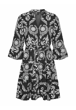 Must kleit, millel on valge lillmuster, pikad varrukad volditud äärega, kihiline seelik ja keha järgnev vöörihm.