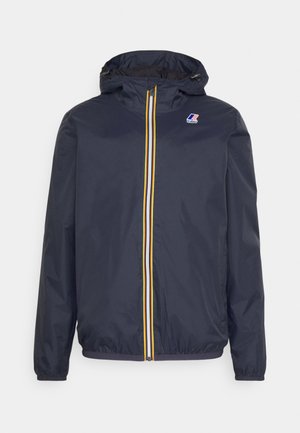 Navy windbreaker jacket with a zip front, featuring yellow and white stripes, adjustable hood, and elastic cuffs. Lightweight fabric.