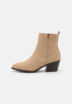 Korte laarzen - beige