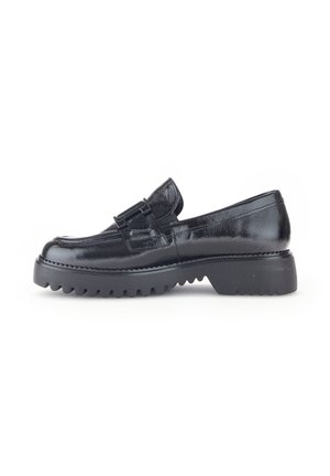 Black patent leather loafer with a decorative buckle, round toe, and chunky, ridged sole for enhanced grip and durability.
