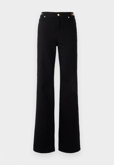 Black flared jeans with a smooth texture, featuring a gold-tone hardware detail at the waistband and classic five-pocket design.