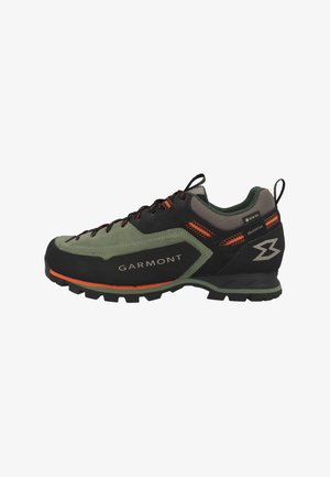 Low-cut hiking shoe in black, green, and orange with rugged sole, Garmont branding, Gore-Tex label, and lace-up closure.
