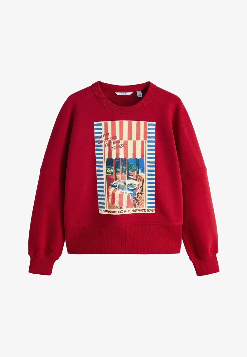 Rdeč pulover s kapuco z grafičnim potiskom prizora kavarne z črtastim nadstreškom in besedilom. Rebrasti manšete in spodnji rob, mehka tekstura tkanine.
