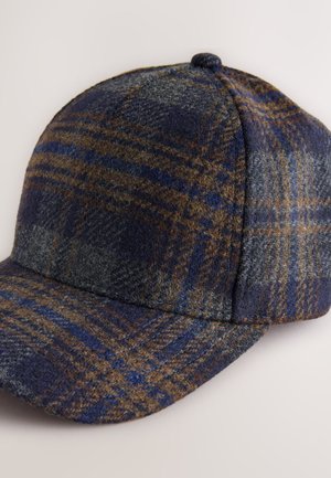 Wełniana czapka z daszkiem w niebiesko-szarą kratę, z zaokrągloną koroną, zakrzywionym daszkiem i fakturowanym materiałem o miękkim wykończeniu.