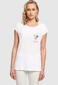 White cotton t-shirt featuring a colorful cocktail graphic with a straw and umbrella, round neckline, and rolled short sleeves.