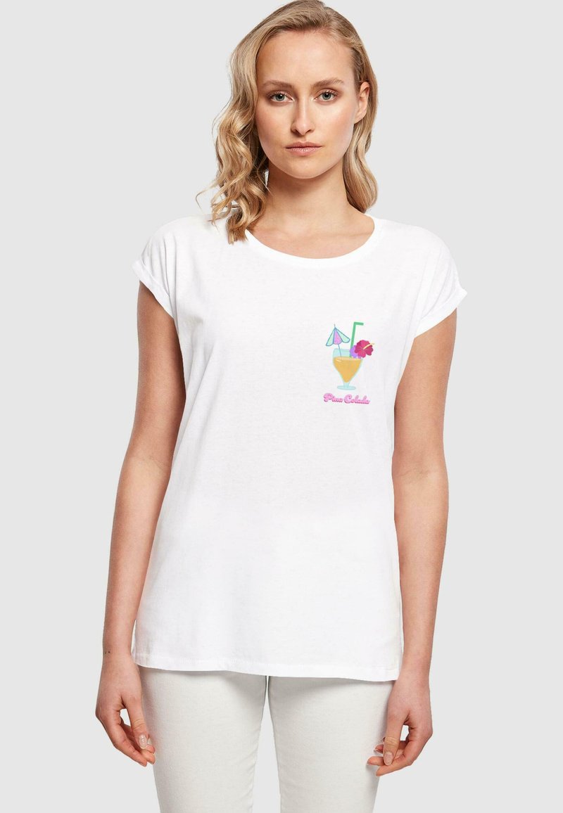 White cotton t-shirt featuring a colorful cocktail graphic with a straw and umbrella, round neckline, and rolled short sleeves.