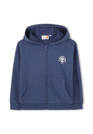 Marineblauwe zip-up hoodie met steekzakken aan de voorkant, geribde manchetten en zoom, capuchon en wit Timberland-logo met boom en "1973" op de borst.