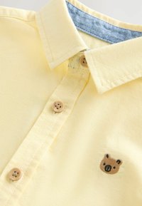 Ikke valgt, yellow bear embroidery