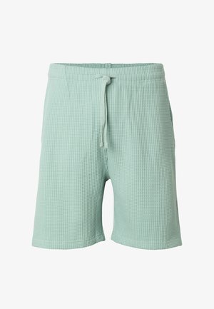 Lysegrønne teksturerede stofshorts med elastik i taljen og snøre, knælange, designet til afslappet brug.