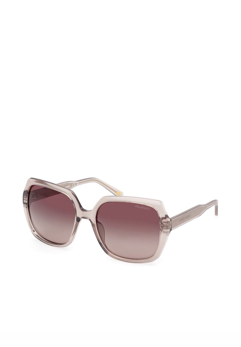 Solglasögon med en geometrisk ram, klar plast med rosa toning, gradient mörka linser och polariserade detaljer på bågarna.