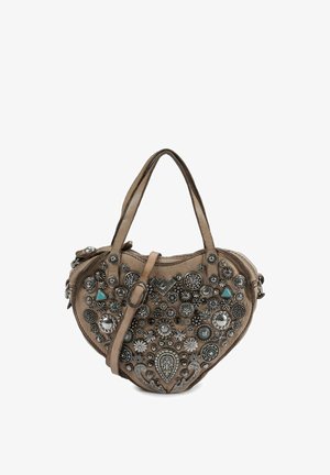 Brown heart-shaped handbag with dual handles and strap, decorated with silver-tone studs, floral and geometric designs, and turquoise accents.