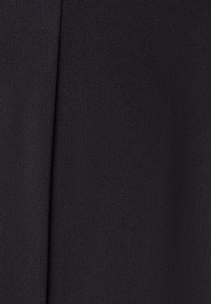 Black textile with a smooth texture and subtle woven pattern, featuring clean lines and a folded design, typical of tailored fabrics.