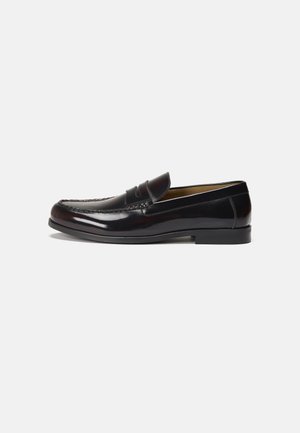 Black leather loafers with a smooth finish, a curved toe, and subtle stitching detail on the vamp. Low, solid black heel.
