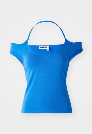 Blue cotton t-shirt with short sleeves and an open shoulder design, featuring a rounded neckline and a logo tag at the center.