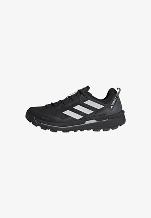 Musta urheilukengät harmailla yksityiskohdilla, verkkopinta, vedenpitävä GORE-TEX, pehmustettu kaula ja kestävä pohja tarttuvuutta erilaisilla maastoilla varten.