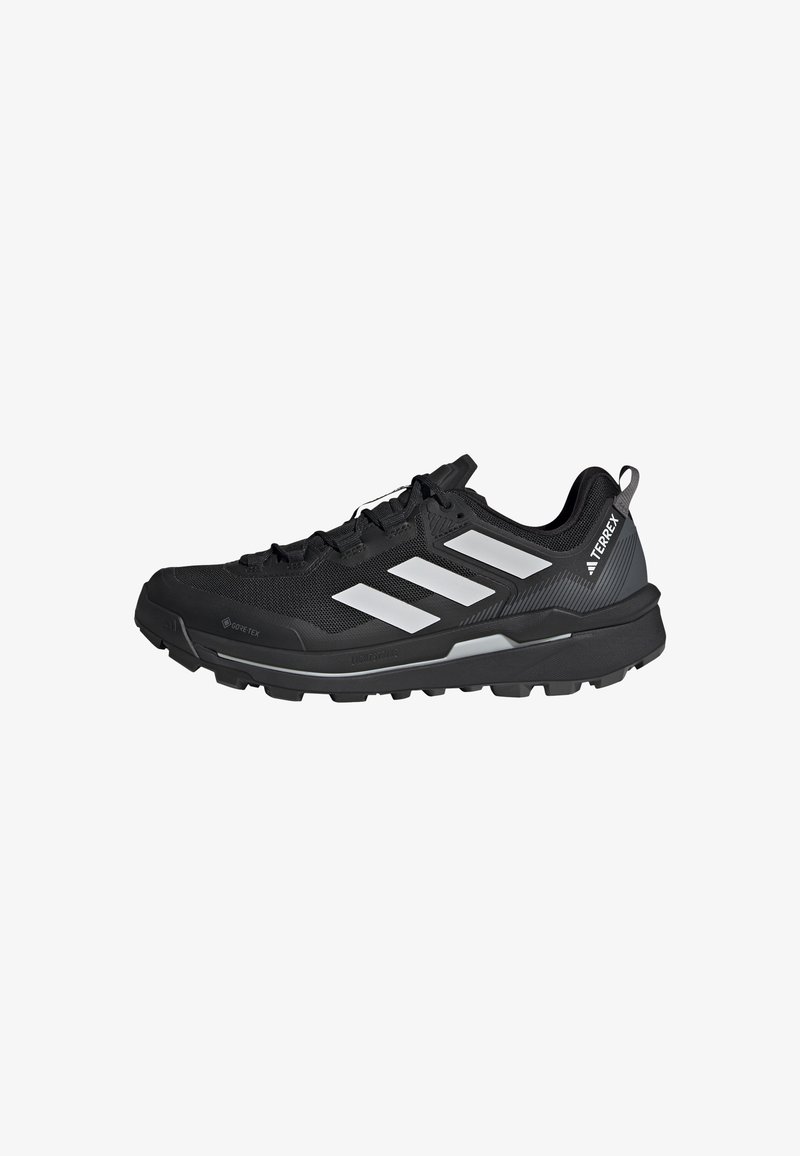 Czarny but sportowy z szarymi akcentami, siateczkowa cholewka, wodoodporny GORE-TEX, wyściółka wokół kostki oraz solidna podeszwa dla przyczepności na różnych nawierzchniach.