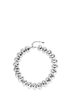 Silver necklace with polished heart-shaped beads linked together and a small adjustable chain clasp on a white background.