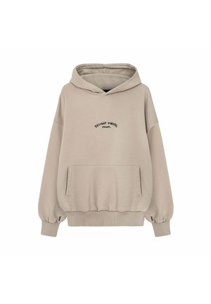 Beżowa bluza z kapturem z przednią kieszenią, prążkowanymi mankietami oraz napisem „Holiday Party” i małym wzorem fali na piersi oraz rękawach.