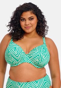 Groen en wit gestreepte bikinitop met een zachte stof, gevormde cups en verstelbare schouderbanden in een zigzagpatroon.