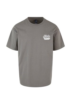 Grå bomulds T-shirt med korte ærmer og rund halsudskæring, præget af et hvidt hexagonalt logo på venstre brystområde.
