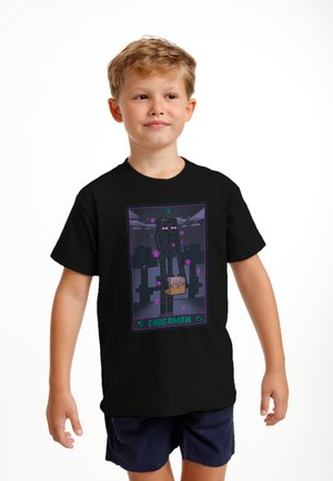 Černé tričko s grafikou Enderman postavy z videohry, obrysy v zelené a fialové, s pixelovými detaily.