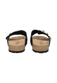 Black suede sandals with cork footbed, adjustable strap with gold hardware, flat sole, and a smooth interior surface.