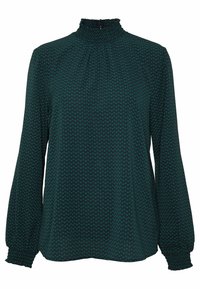 Blusa verde scuro a maniche lunghe con alto colletto arricciato e polsini, caratterizzata da un piccolo motivo a zigzag su tutta la superficie del tessuto.