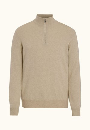 Beige lang gebreide trui met lange mouwen, een halve rits bij de kraag en geribbelde boorden en zoom.