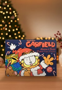 Calendario dell'avvento a tema Garfield per calze da donna, con illustrazioni colorate, sportelli numerati e uno sfondo blu scuro. Misura 35-41.