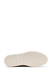 Shoe sole with a textured rubber surface, featuring a white color and a patterned tread for traction. Smooth edge and slight curve at the toe.