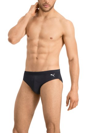 Black swim briefs with a smooth texture, featuring a white Puma logo on the left hip. The design is minimalist and form-fitting.