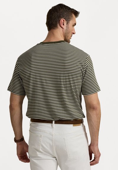 Short-sleeve green and white striped T-shirt with a round neckline. The fabric appears soft. Worn with white pants and a brown belt.