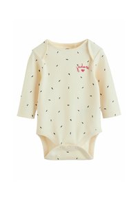 Krämsribbat långärmad babybodysuit med små utspridda svarta streck och rosa "j’adore"-text med hjärta på bröstet.