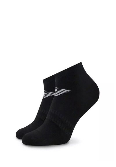 Chaussettes noires à la cheville en tissu lisse, avec un motif géométrique blanc sur le côté et des détails en côtes au niveau du bord.