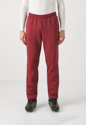 Rode sweatpants met een elastische tailleband, met een slanke pasvorm, zachte textuur en subtiele merkdetails in het rood op de linkerdij.