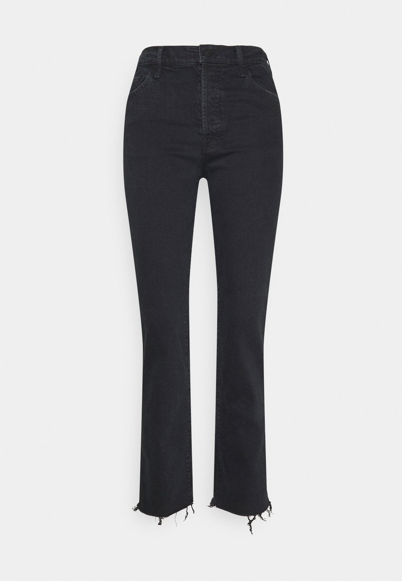 Jean noir taille haute, coupe droite, avec ourlets effilochés et coutures avant visibles sur un fond uni clair.
