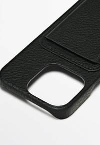 Black leather phone case with a textured finish, featuring a pocket for cards and a cutout for the camera. Edges are smooth.