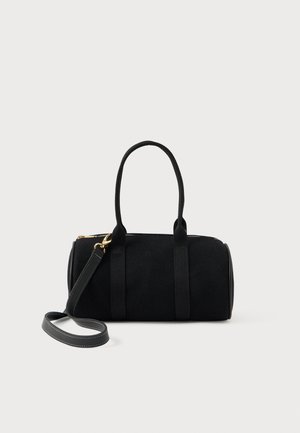Sort cylindrisk håndtaske med dobbelthåndtag og en aftagelig skulderrem, udstyret med guldfarvet hardware og lynlåslukning i toppen.