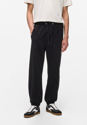 FLEECE LOUNGE - Donji dijelovi trenirke - black