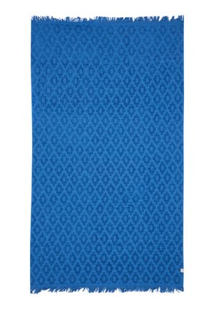 Blauer Textilstoff mit sich wiederholendem geometrischem Muster und fransierten Kanten, vermutlich ein gewebter Schal oder ein Tuch.