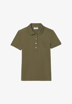 Polo shirt vert olive en coton texturé. Doté d'un col, d'une patte de boutonnage à trois boutons et d'un logo brodé sur la poitrine gauche.
