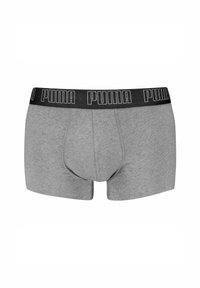 Boxer aderenti grigi con elastico nero in vita che presenta la parola "Puma" in bianco. Realizzati in materiale morbido e elasticizzato con una vestibilità aderente.