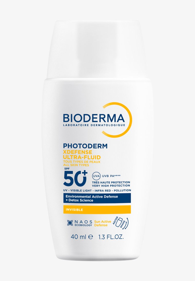 Contenitore per crema solare, plastica bianca, capacità 40 ml. Presenta testi blu e gialli, etichettato SPF 50+, con un design liscio e curvo.