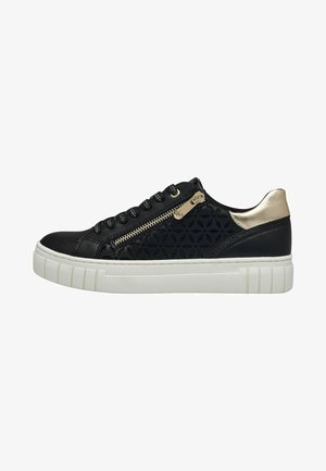 Black leather sneaker with patterned side panel, white rubber sole, decorative zipper, and metallic gold accents on heel.