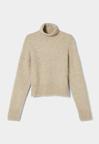 Beige kortärmad polotröja i mjukt, texturerat material. Den har ribbade manschetter och en mysig, åtsittande krage.